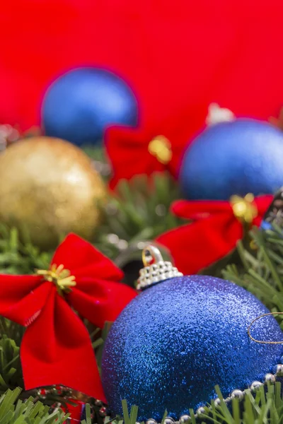 Christmas ornaments on red background — Stock Photo, Image