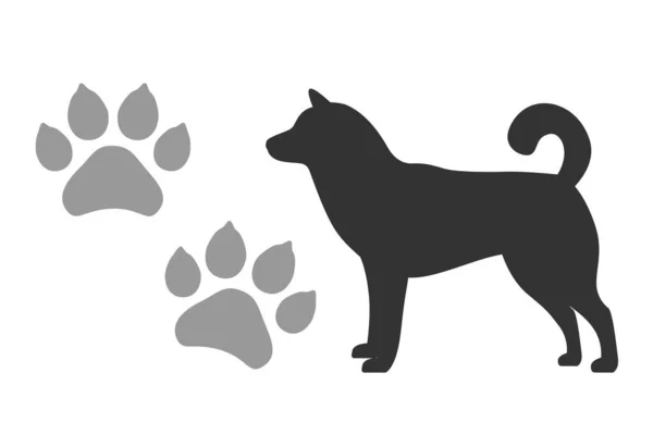 Pegadas de cães vetores e silhueta de um cão preto isolado em um fundo branco Vetores De Stock Royalty-Free