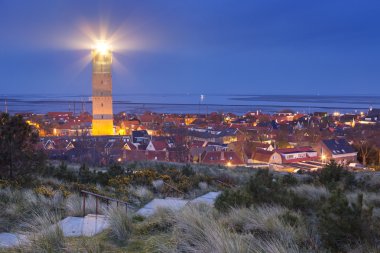 The Brandaris lighthouse on Terschelling, The Netherlands at dusk clipart