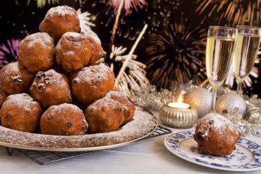 Dutch New Year's Eve with oliebollen, a traditional pastry clipart