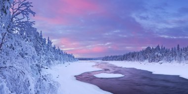 Sunrise over river rapids in a winter landscape, Finnish Lapland clipart