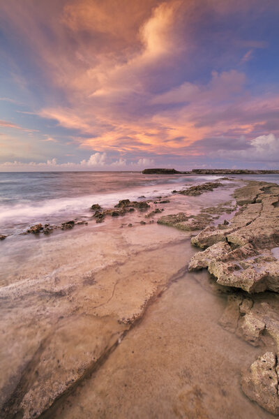 Rocky coast on the island of Curacao at sunset