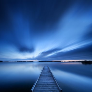 Jetty on a lake at dawn, near Amsterdam The Netherlands clipart