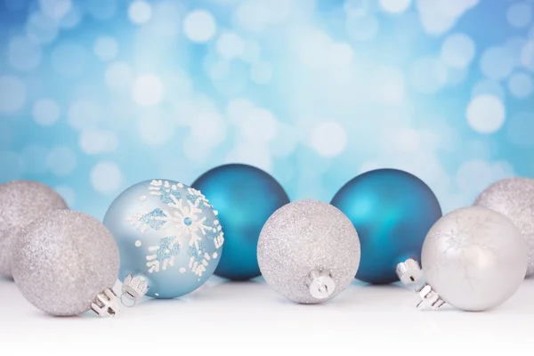 Blue and silver Christmas scene with baubles — Stock fotografie