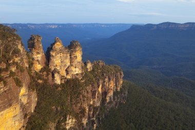 Three Sisters rock formation, Blue Mountains, Australia at sunset clipart