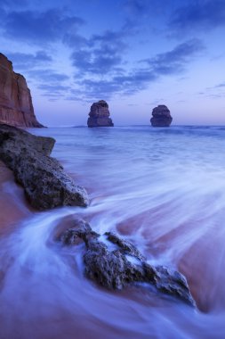 Twelve Apostles on the Great Ocean Road, Australia at dusk clipart