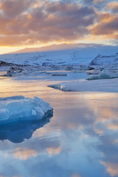 Icebergs in Jokulsarlon glacier lake at sunset