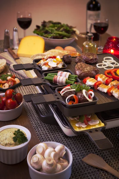 Raclette table-top grill or the Dutch variant 'gourmetten' — Stock Fotó