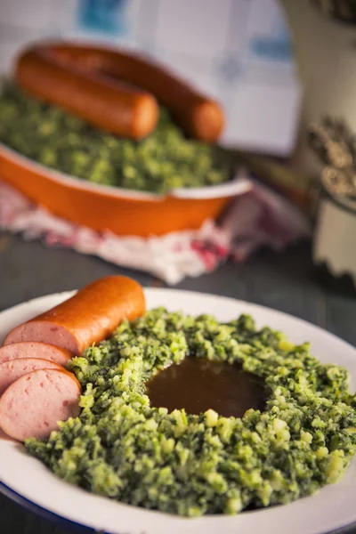 Dutch food: kale with smoked sausage or 'Boerenkool met worst' — Stock Image Dutch food: kale with smoked sausage or 'Boerenkool met worst' Royalty Free Stock Images