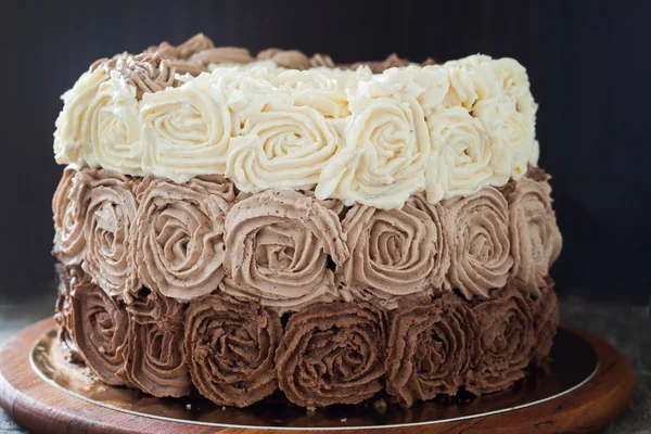 Birthday cake decorated with three chocolate cream roses