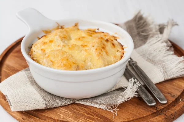Potato gratin with herbs in batch form — Stock Photo, Image