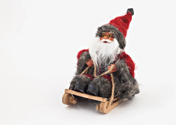 Santa Claus with a beard on a sled tree toy isolated — Stock Photo, Image
