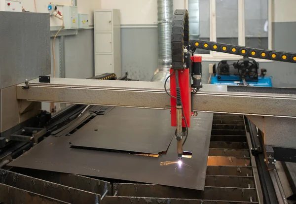 Industrial laser or plasma cutting processing manufacture technology of flat metal sheet. unit in action