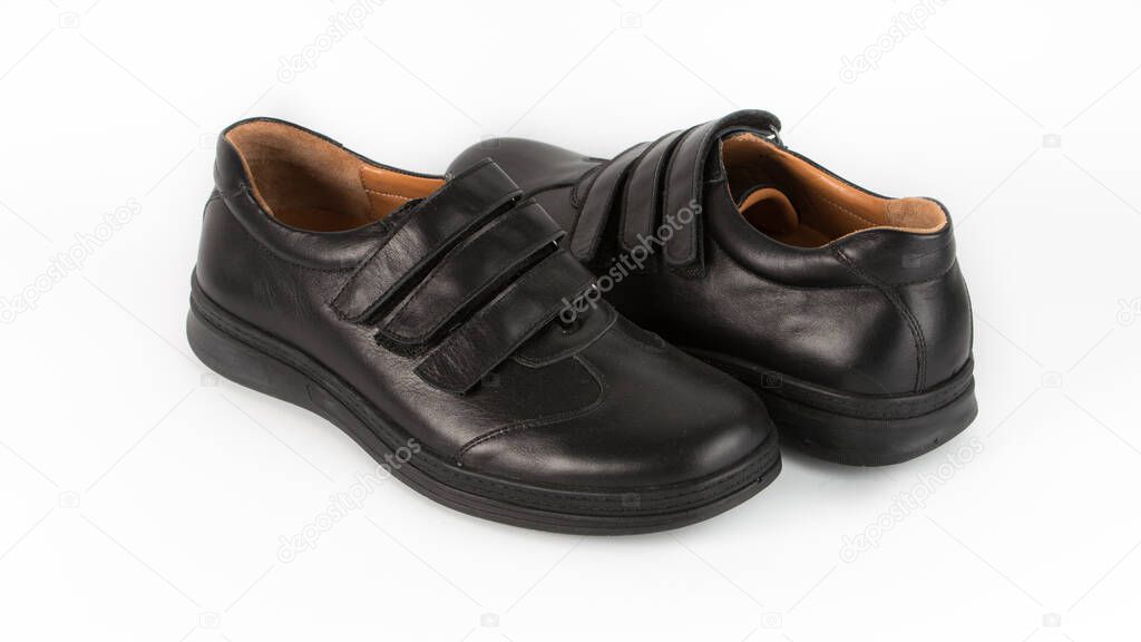 childrens black orthopedic shoes on a white background