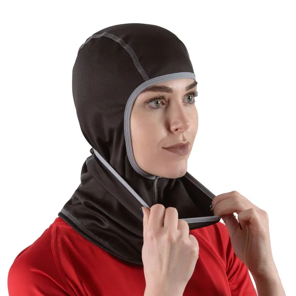 Pretty brunette with long hair in a red shirt with a black balaclava with gray edging — Stock Photo, Image