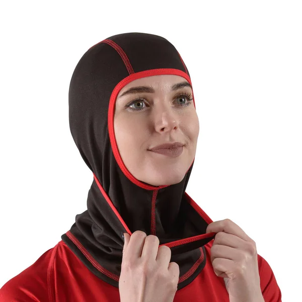 Pretty brunette with long hair in a red shirt with a black balaclava with red edging — Stock Photo, Image