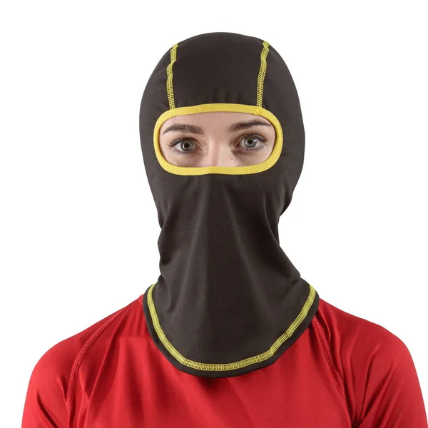 Pretty brunette with long hair in a red shirt with a black balaclava yellow edging — Stock Photo, Image