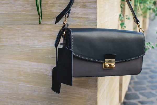 Luxury black women bag clutch. Street outdoor — Stock Photo, Image