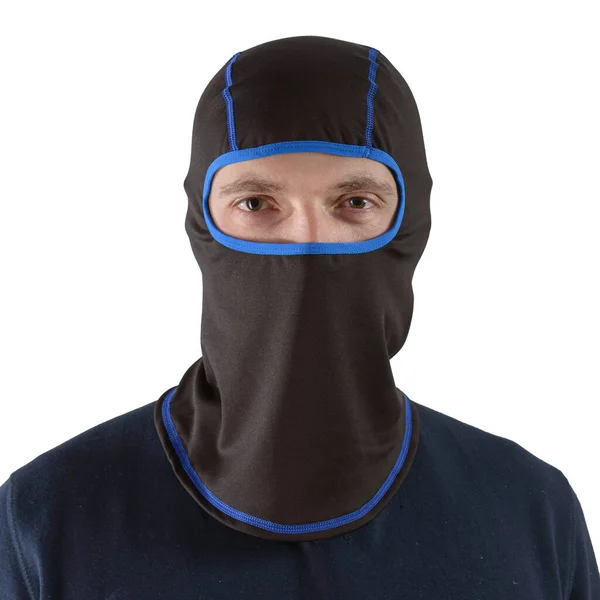 Brunette man in a blue shirt with a black balaclava with dark blue edging — Stock Photo, Image