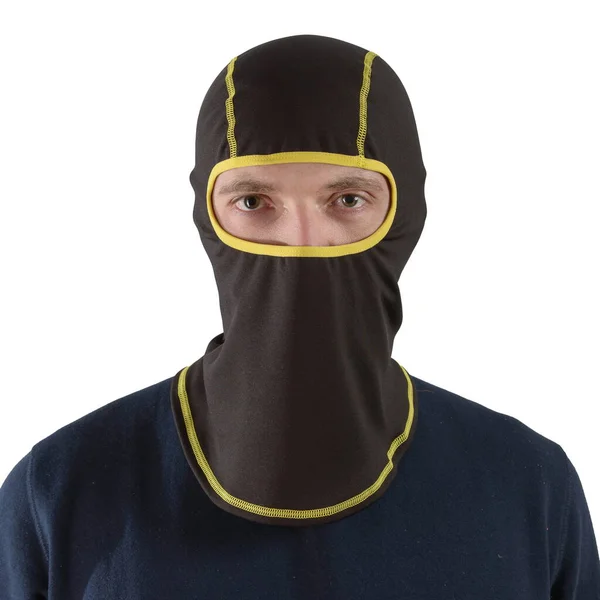Brunette man in a blue shirt with a black balaclava with yellow edging — Stock Photo, Image