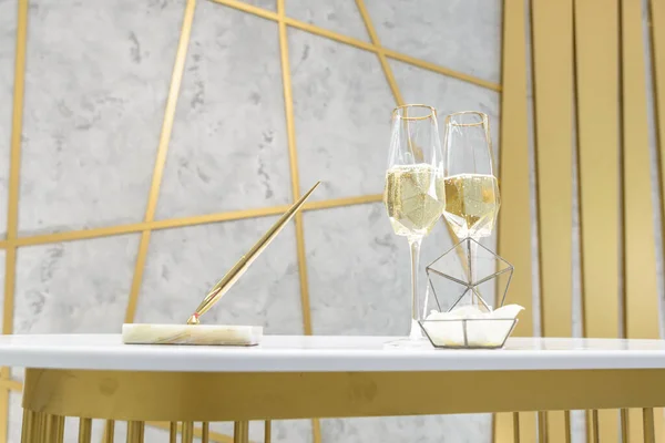 Two glasses of champagne on a white table — Stock Photo, Image