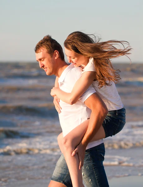 Happy young couple in love have fun on beautiful beach at beauti Stock Photo