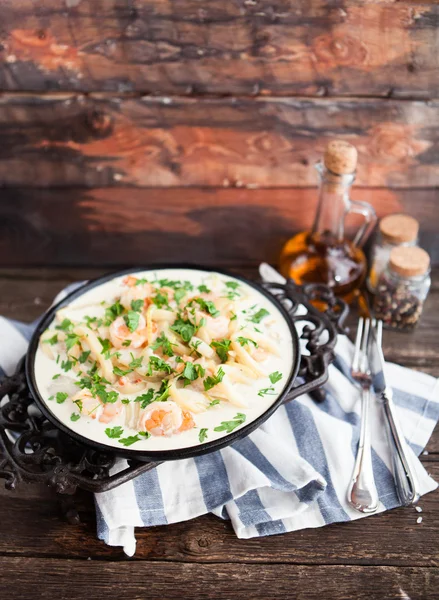 Seafood - shrimp and squid  with white cream sauce on  frying pa — Stock Photo, Image