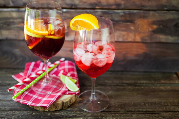 Sangria  and ingredients in glasses  on a rustic wood — Stock Photo, Image