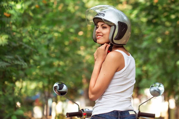 Attractive woman wears helmet — Stok fotoğraf