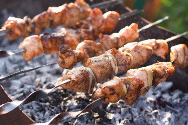 Smoky grilled marinated meat skewers Chicken clipart
