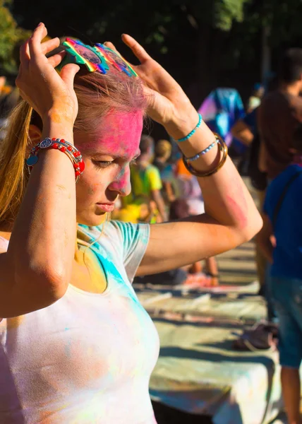 Portrait of young blondy girl on holi color festival — ストック写真