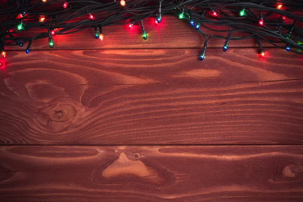 Рождественский деревенский фон - старинные доски древесины с огнями — стоковое фото