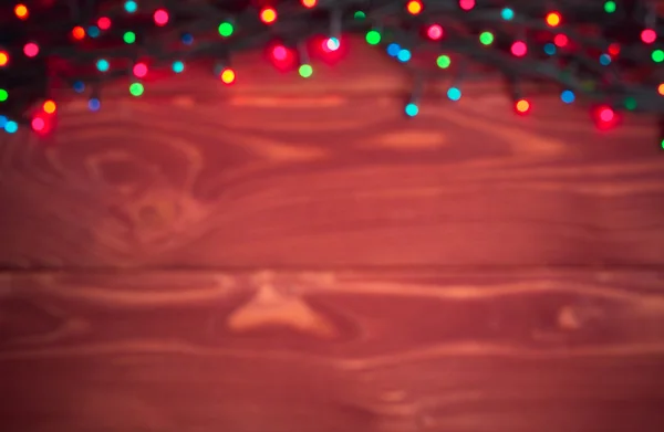 Fondo rústico de Navidad - madera de tablones vintage con luces a Imagen de stock