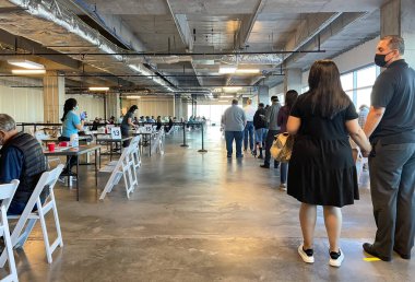 Frisco TX, USA - March 26, 2021: Indoor view of people waiting in lines to get the COVID-19 vaccine