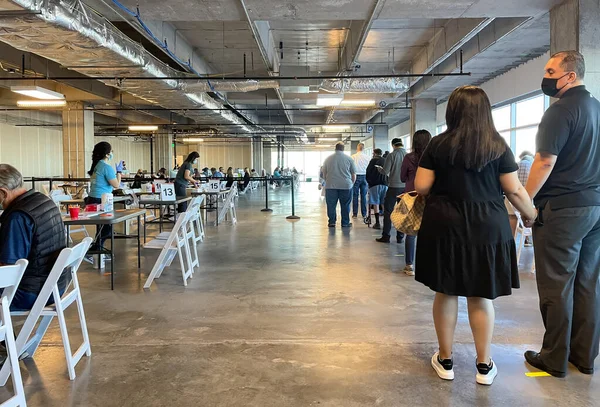 Frisco TX, USA - March 26, 2021: Indoor view of people waiting in lines to get the COVID-19 vaccine
