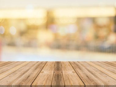 Ahşap Pano boş tablo arka plan bulanık. Perspektif kahverengi ahşap üzerinde alışveriş merkezinde bulanıklık - görüntülemek için kullanılan veya ürün montaj. Ürün görüntüleme için alay.
