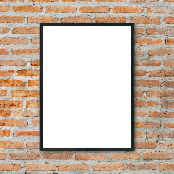 Mock up blank poster picture frame on brick wall.