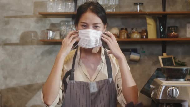 Young Asia Female Restaurant Staff Wearing Protective Face Mask Using — Stock Video