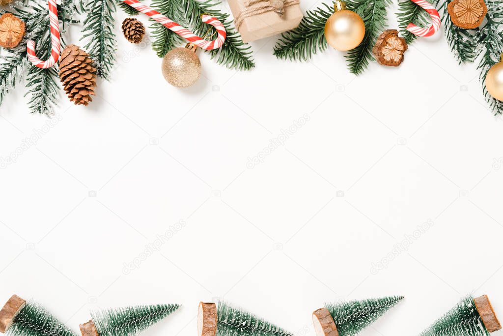 Minimal creative flat lay of christmas traditional composition and new year holiday season. Top view winter christmas decorations on white background with blank space for text. Copy space photography.