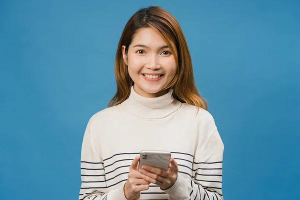 Surprised Young Asia Lady Using Mobile Phone Positive Expression Smile Royalty Free Stock Photos