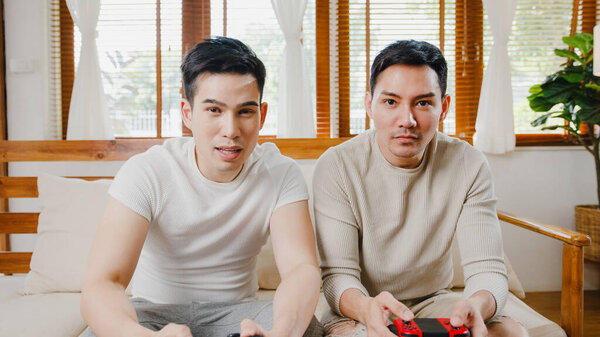 Happy Asia Young Gay Couple Sit Couch Use Joystick Controller Stock Image