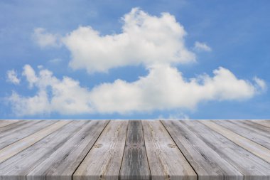 Vintage wooden board empty table in front of sky background. Perspective wood floor over sky - can be used for display or montage your products. beach & summer concepts. vintage filtered image.