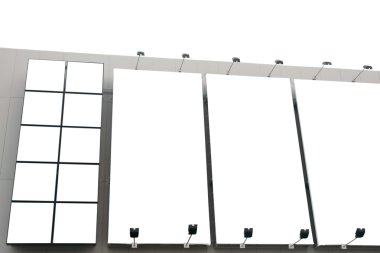 Blank poster billboard wall with copy space for your text message or content in modern shopping mall on white background.