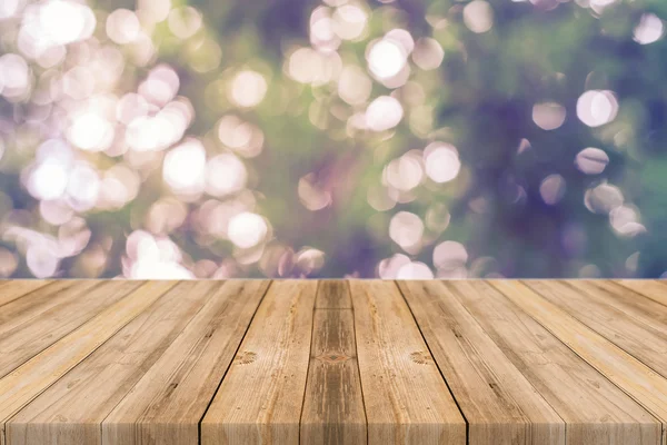 Wooden board empty table in front of blurred background. Perspective grey wood over blur trees in forest - can be used for display or montage your products. vintage filtered image. — 图库照片