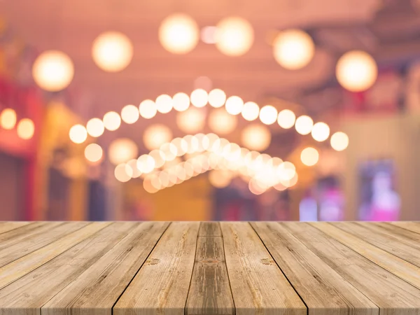 Wooden board empty table in front of blurred background. Perspective brown wood over blur in coffee shop - can be used for display or montage your products.Mock up for display product. vintage filtered image. Royalty Free Εικόνες Αρχείου