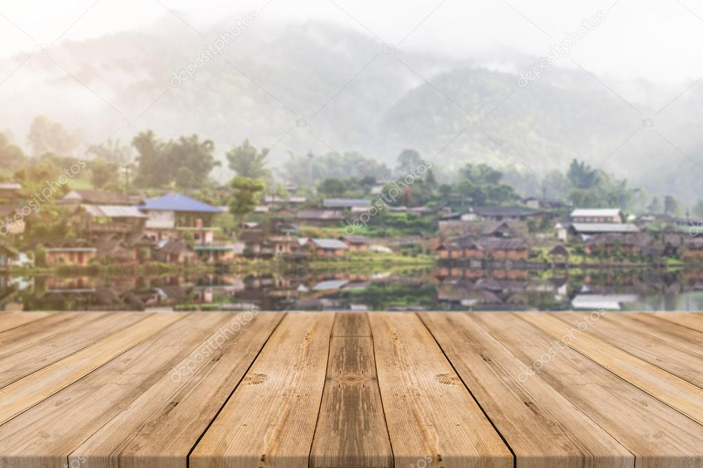 Wooden board empty table in front of blurred background. Perspective brown wood over blur lake in mountain - can be used for display or montage your products. spring season.