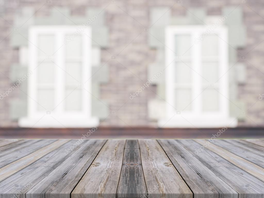 Wooden board empty table in front of blurred background. Perspective grey wood over blur ceramic tile brick wall in background - can be used for display or montage your products.