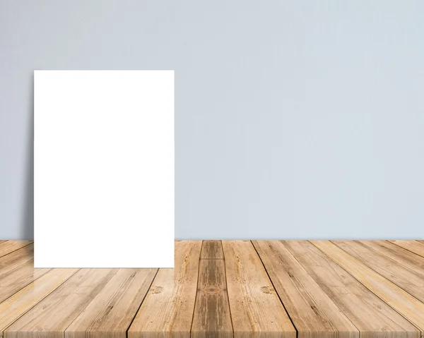 Blank white paper poster at tropical plank wooden floor and paper wall