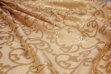 Cloth with golden reflections clipart