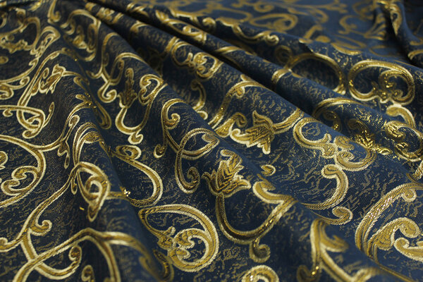 Благородная голубая ткань с цветочными орнаментами
